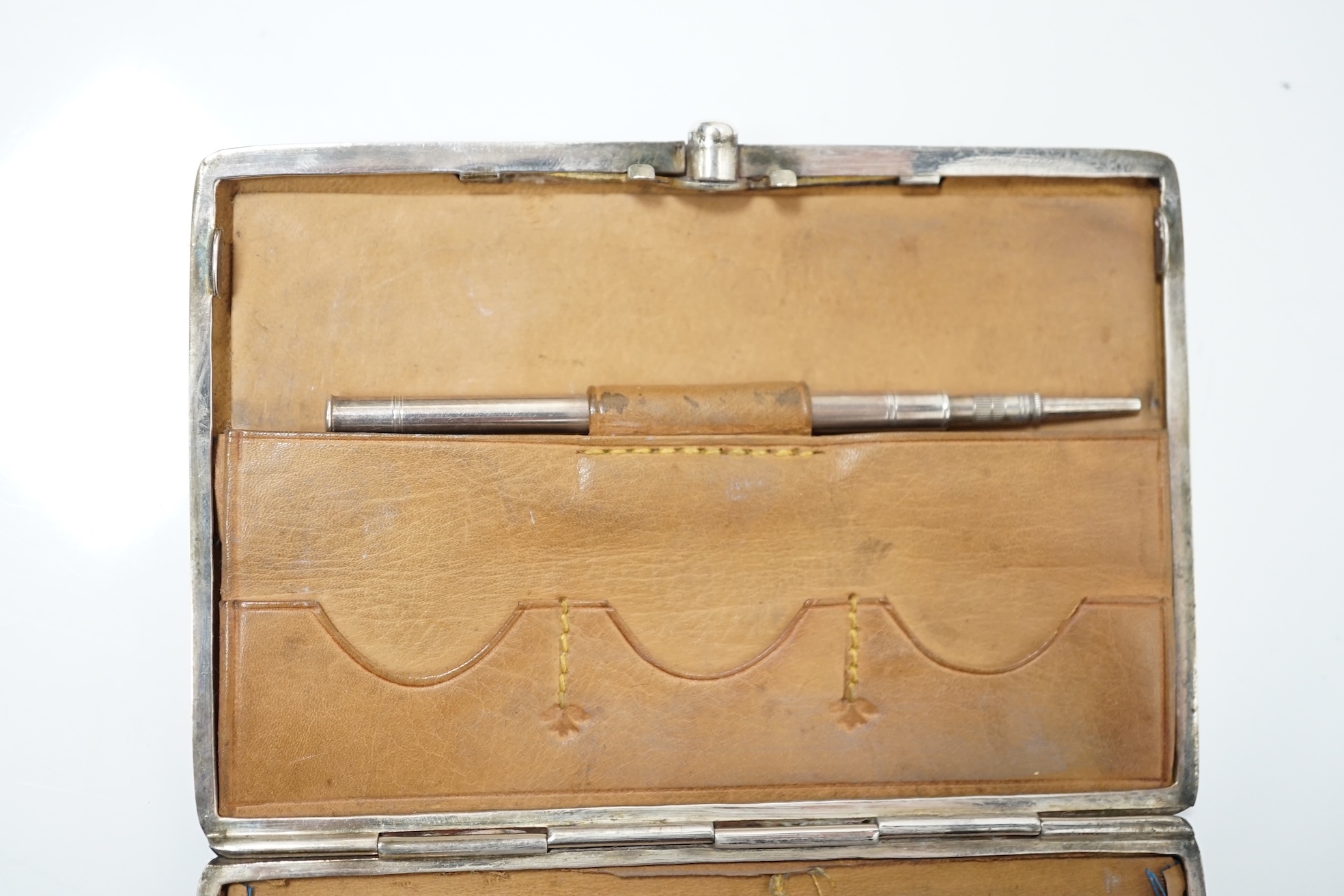 A Victorian engraved silver card purse with pencil and leather interior, Deakin & Francis, Birmingham, 1897, 10.5cm. Condition - good